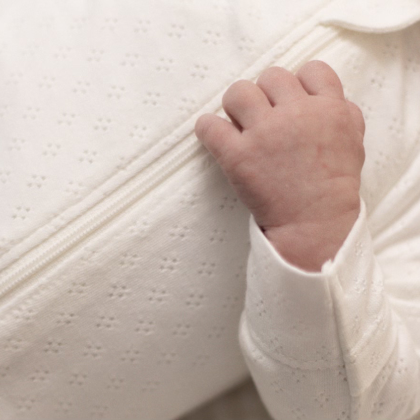 Baby in white essential clothing
